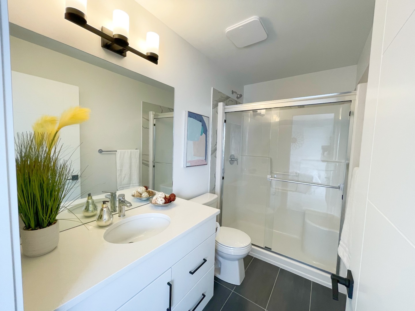 Bathroom with glass-enclosed shower at 4310 28 Avenue S