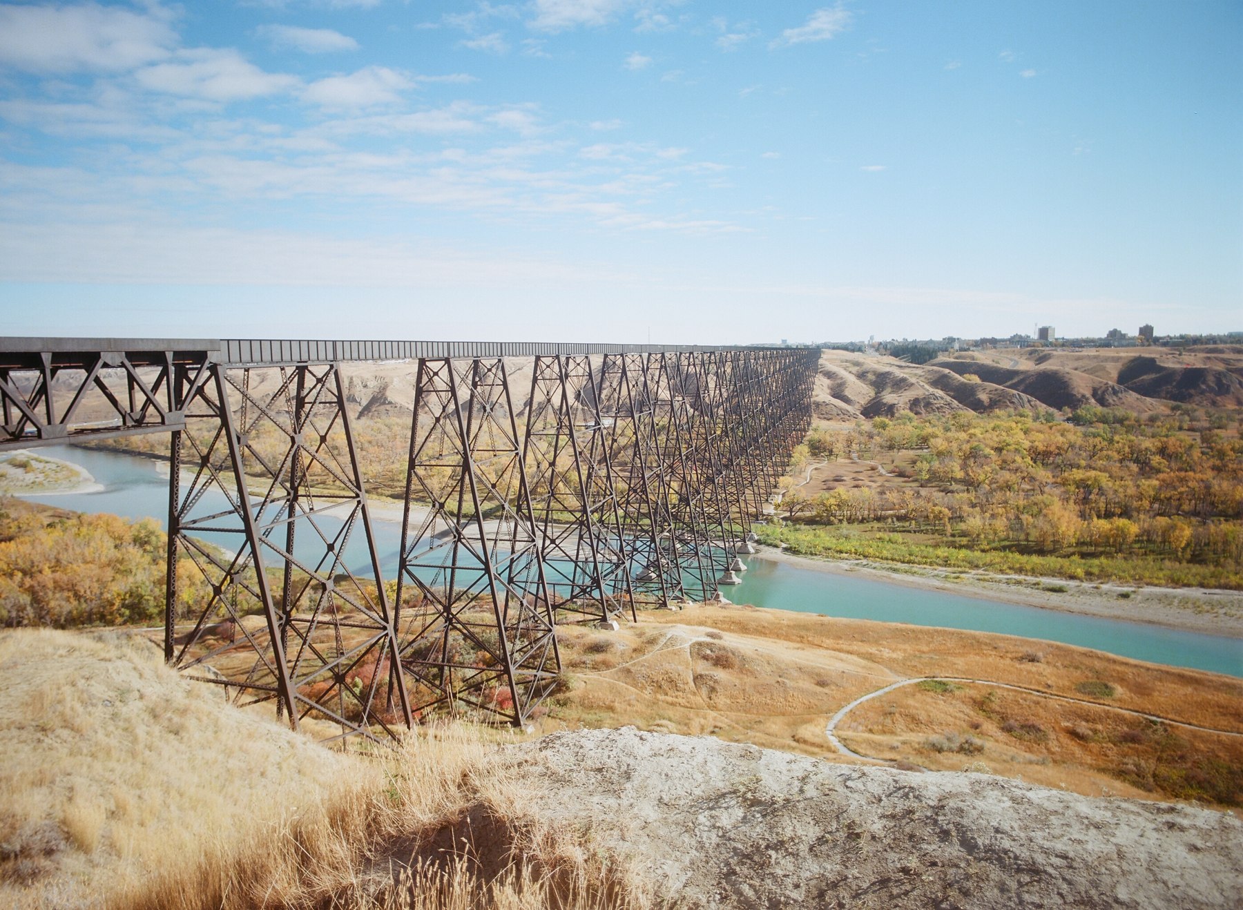 High Level Bridge spanning the Oldman River with golden autumn foliage