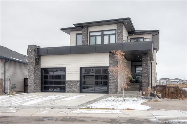 Contemporary stone-accented home exterior, supplied by Cindy
